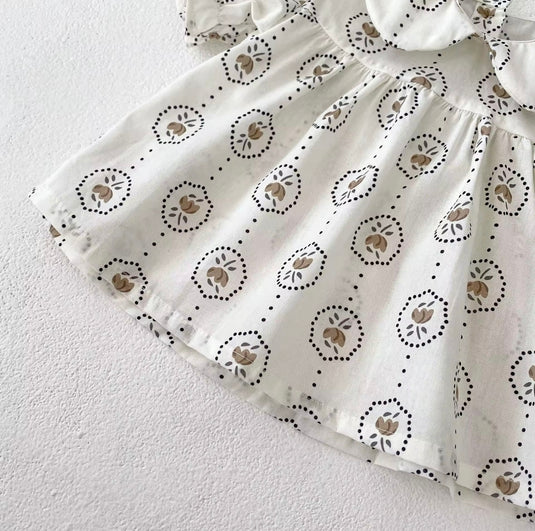 Summer baby romper with round floral patterns