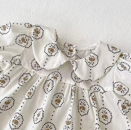 Summer baby romper with round floral patterns