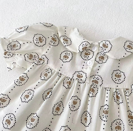 Summer baby romper with round floral patterns