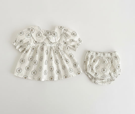 Summer baby romper with round floral patterns