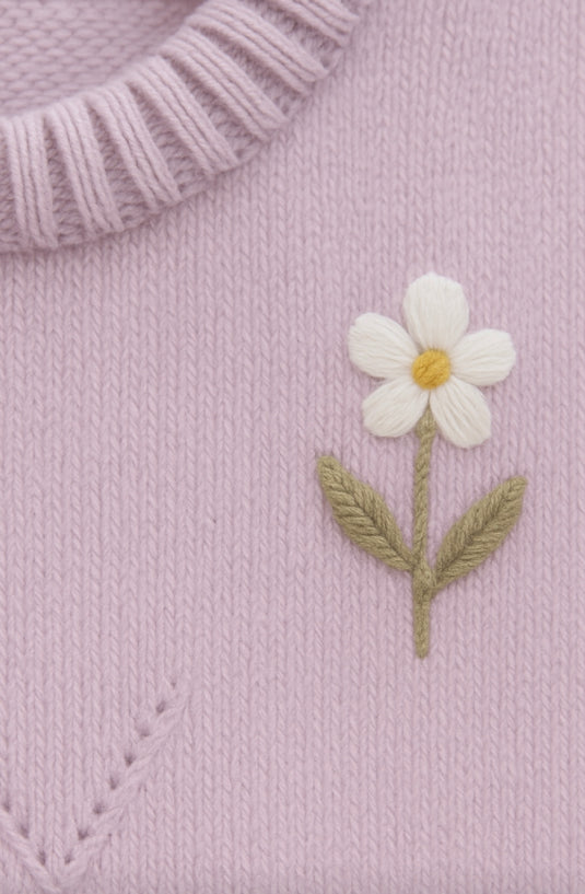 Soft lilac knitted baby jumpsuit with embroidery